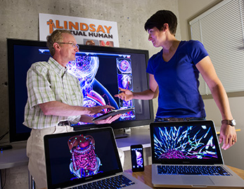 Dr. Heather Jamniczky (right) and Dr. Chrsitian Jacob showing 3D anatomy software created at the University of Calgary